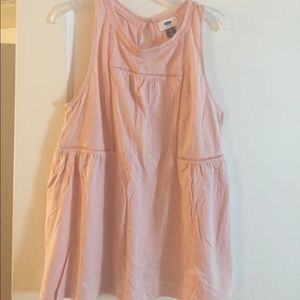 Tank with small cut out designs