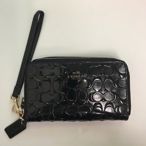 Coach patent op art zip around wristlet wallet.