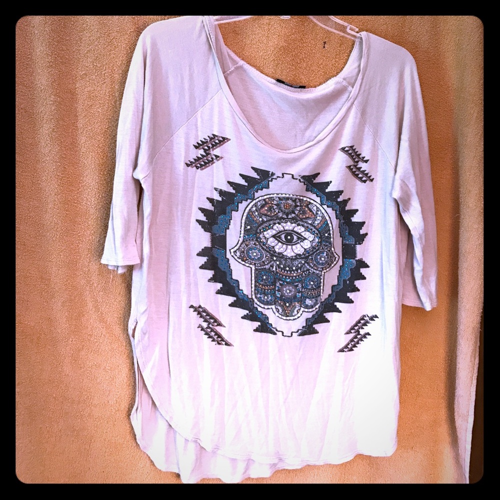 Loose fitting shirt with beaded design