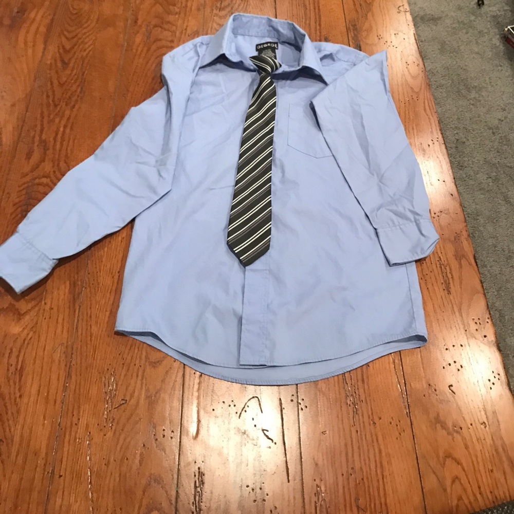 Light blue dress shirt and black and white tie