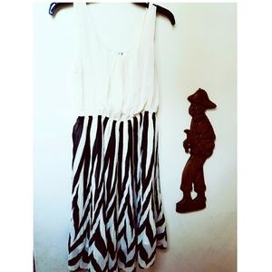 Black and cream flirty dress .