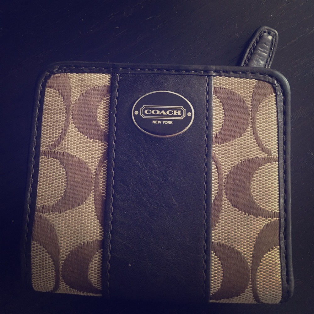 Coach bi fold wallet with snap lock in dark brown