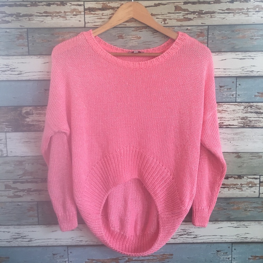 Neon pink high low cropped sweater.