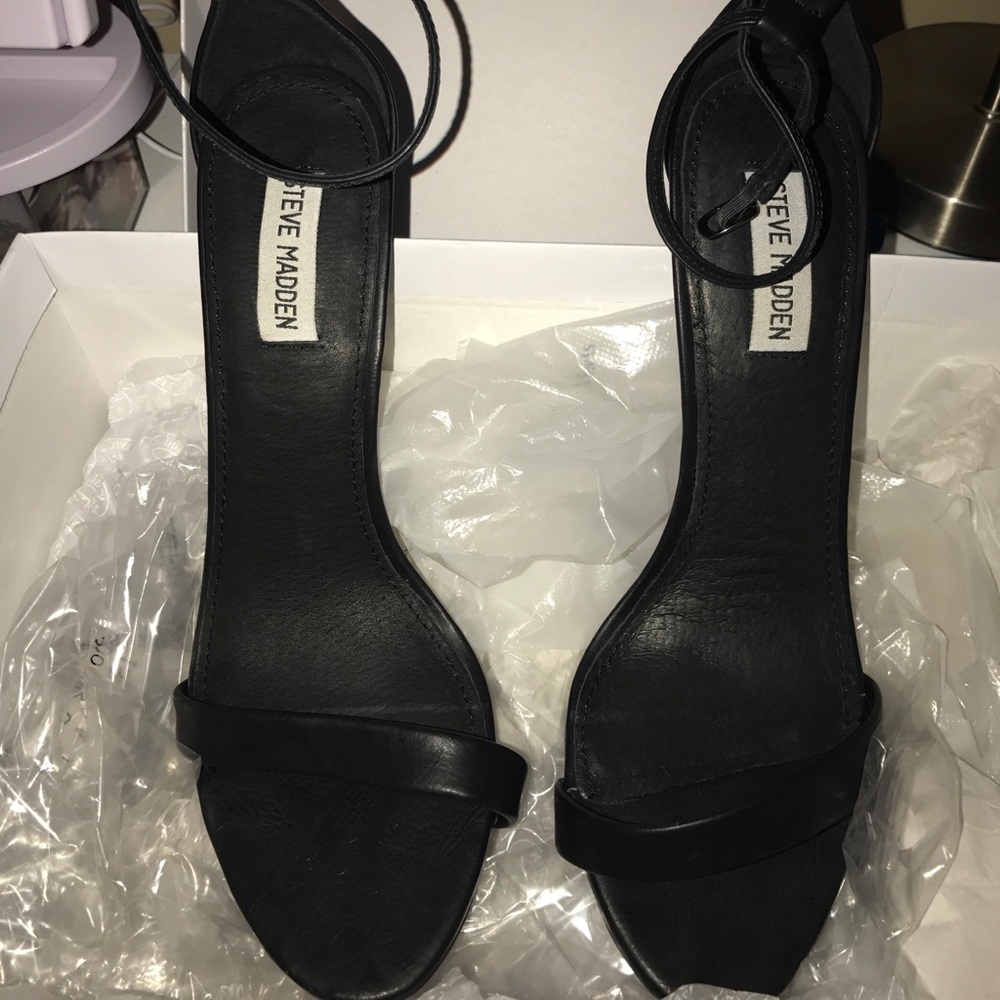 Steve Madden black strappy heels.