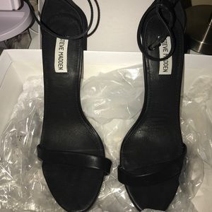Steve Madden black strappy heels.
