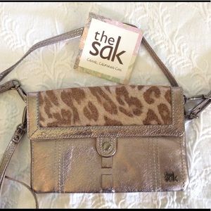 SAK leather cross body or clutch.
