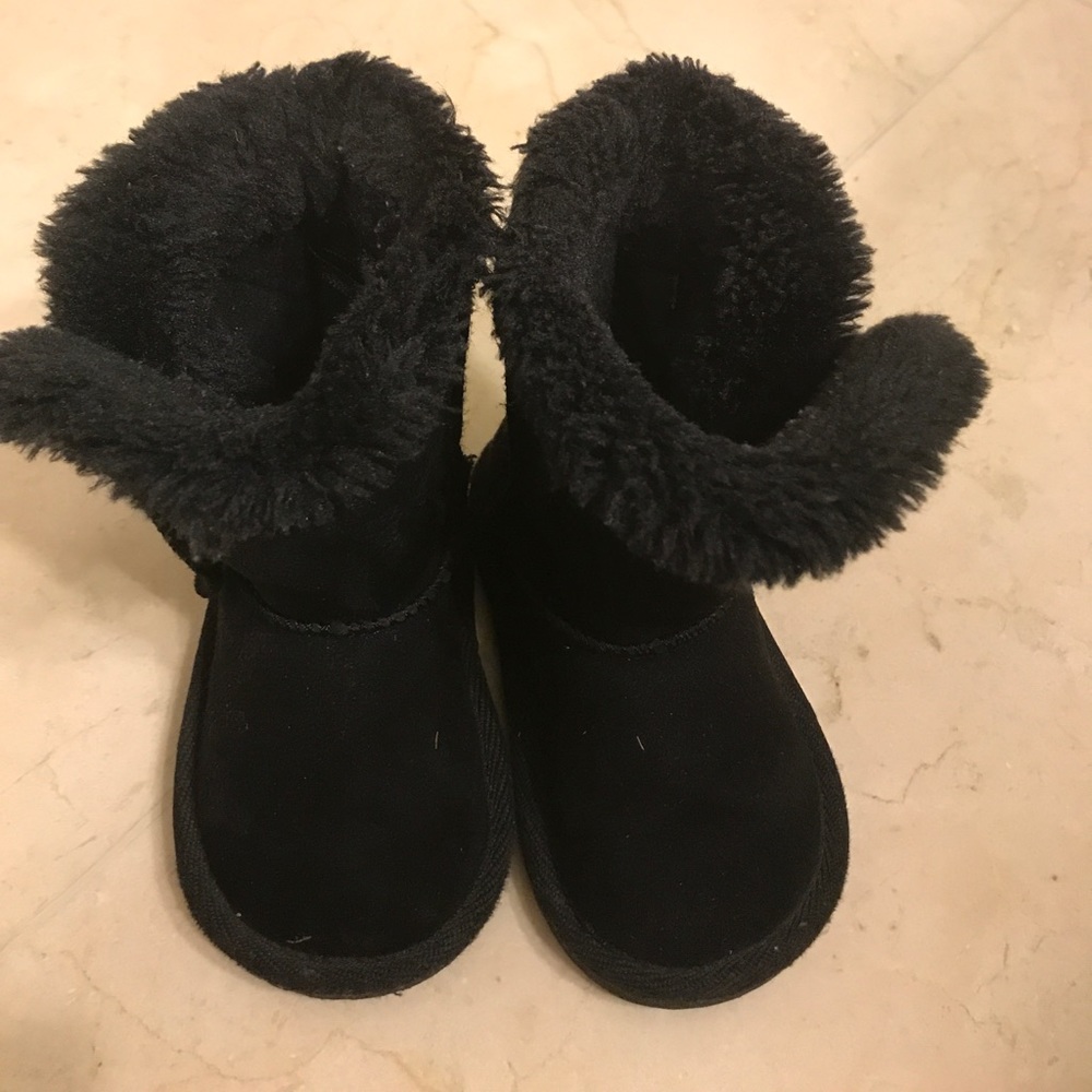 Children place black boots used