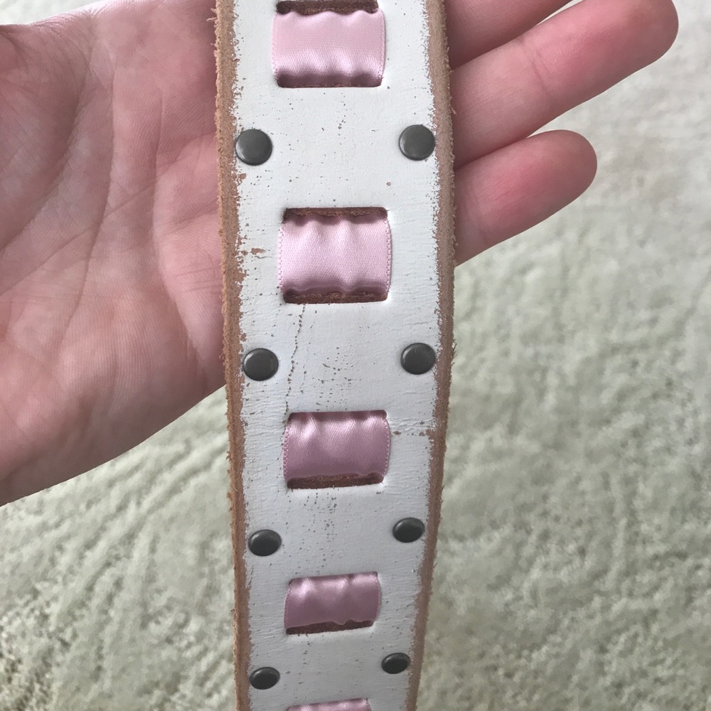 White leather belt with pink ribbon