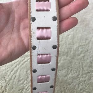 White leather belt with pink ribbon