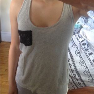 A grey tank top with a lace back