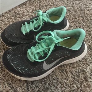 Green and black nike free runs
