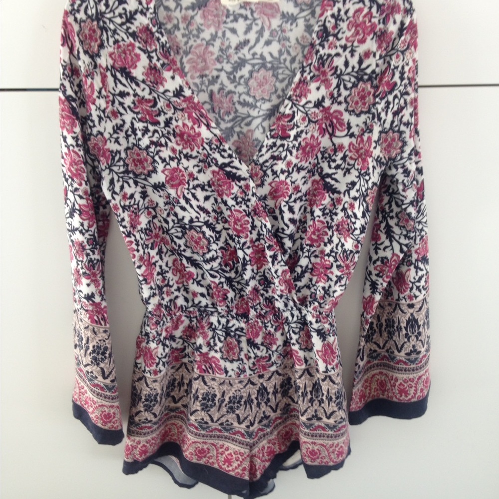 Pink, blue, and white long sleeved romper