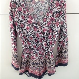 Pink, blue, and white long sleeved romper