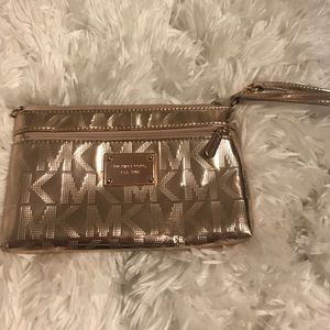 Rose gold Michael Kors wristlet