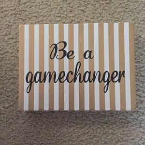 "Be a gamechanger" sign