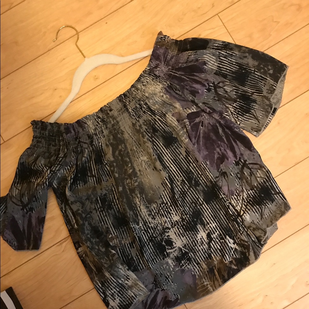 Gimmicks off the shoulder top