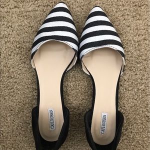 Black and white pointed toe flats