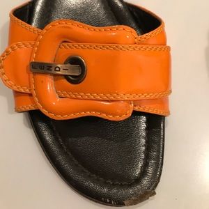 Fendi orange sandals.