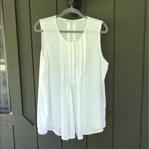 Off white, long, sleeveless, flowy top.