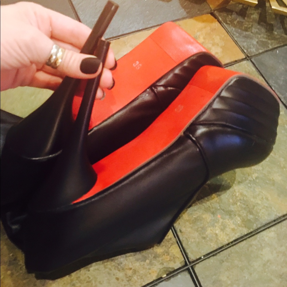 Red bottomed knee high boots