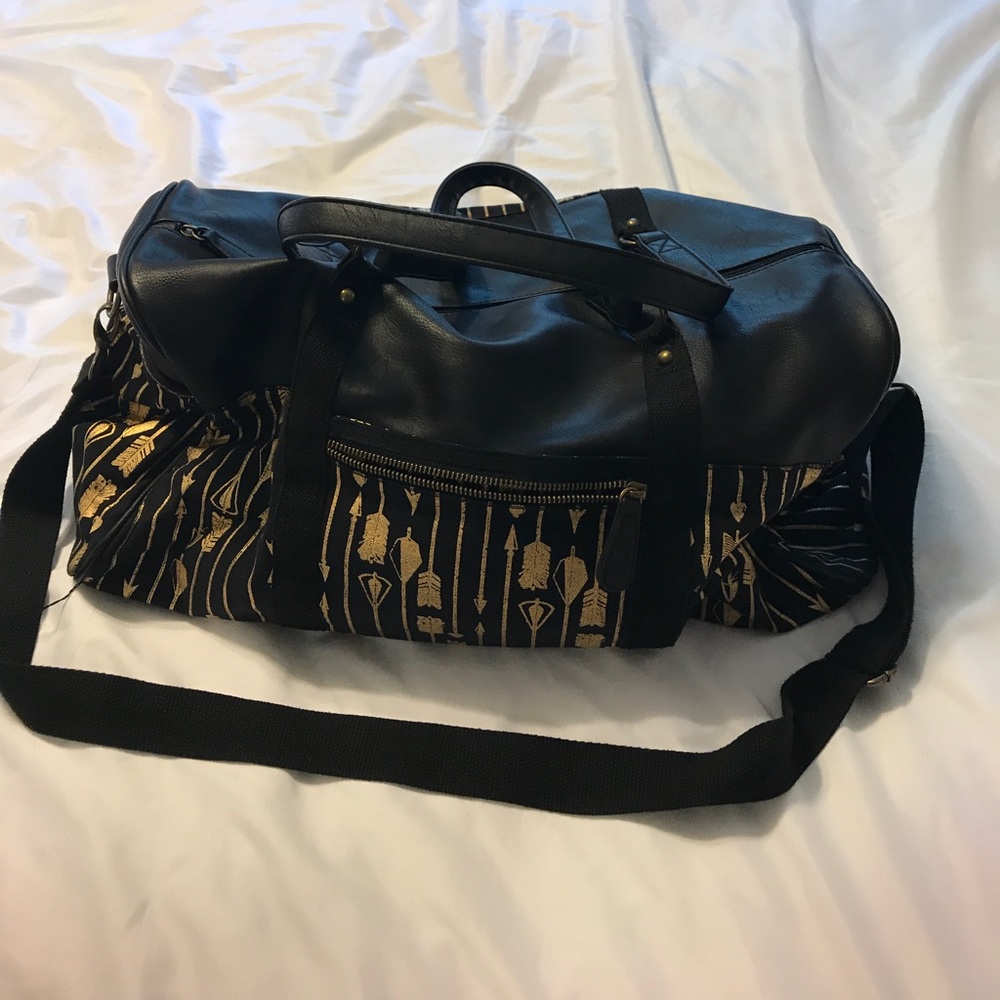 Gold and black duffel bag
