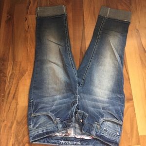 Medium wash Maurice's Capri jeans.