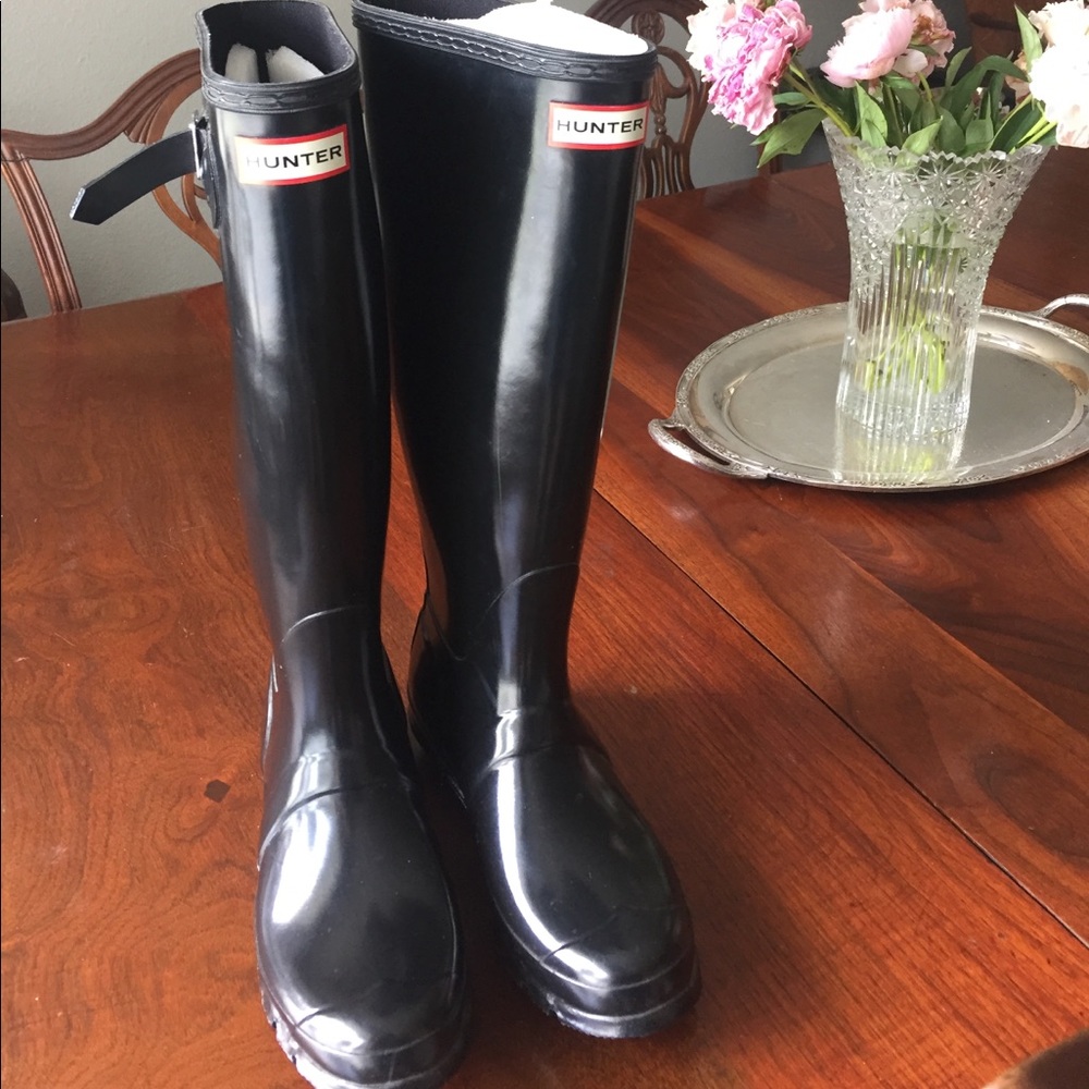 Tall black hunter boots