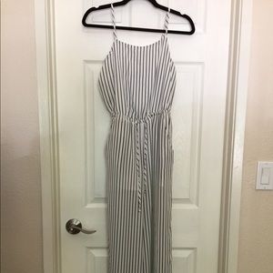 Black and white vertical striped long jumpsuit