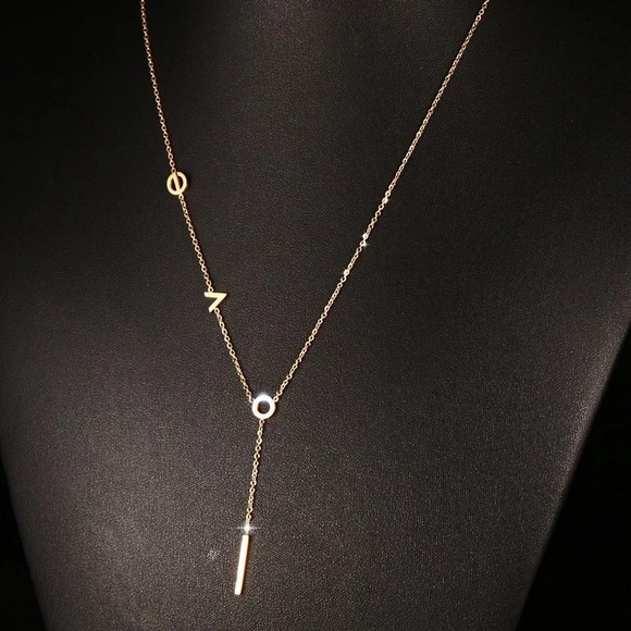 Jewelry - Festival L.O.V.E. gold lariat necklace. NWT