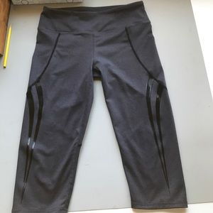 Dark gray Capri workout leggings. Black detail.
