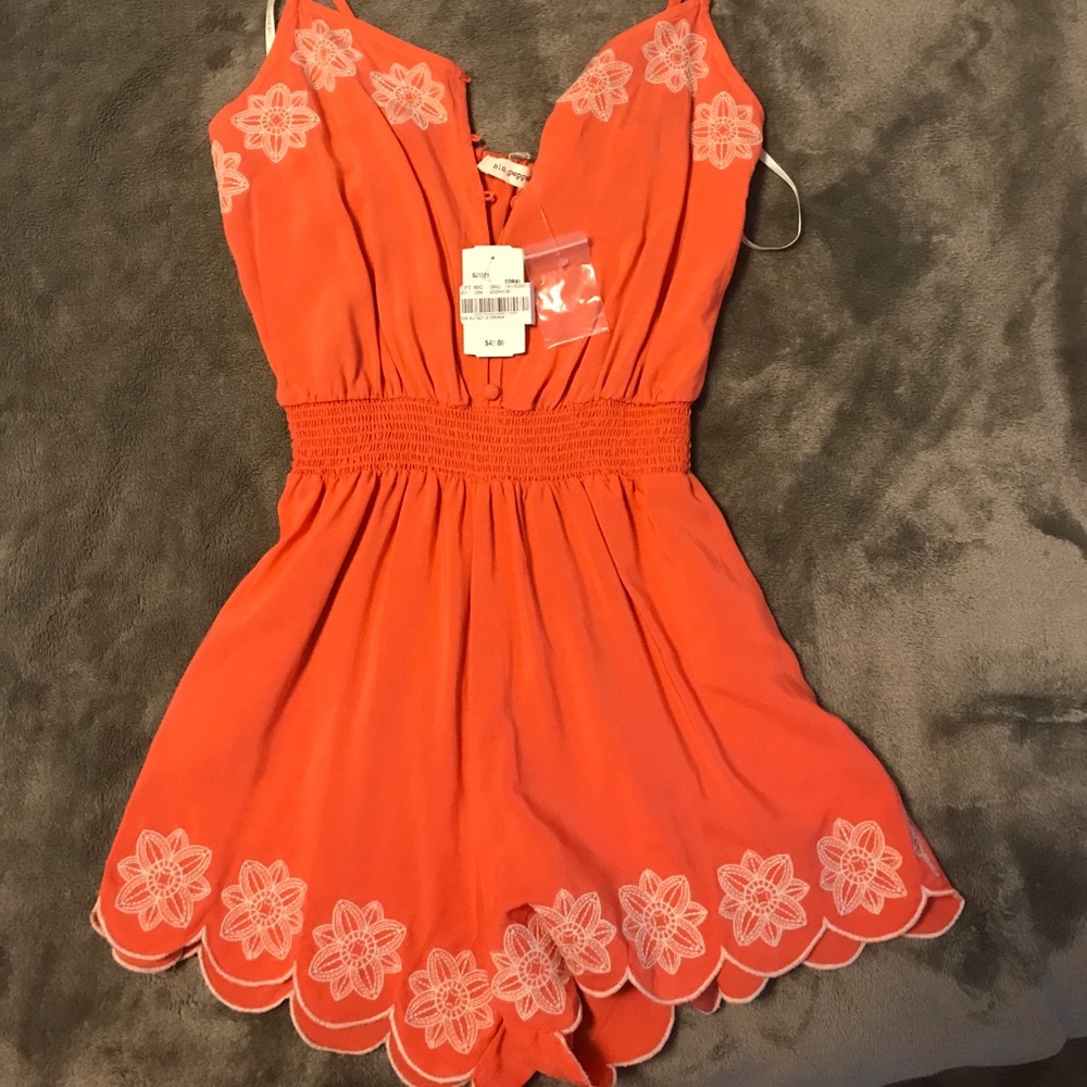 Orange romper.