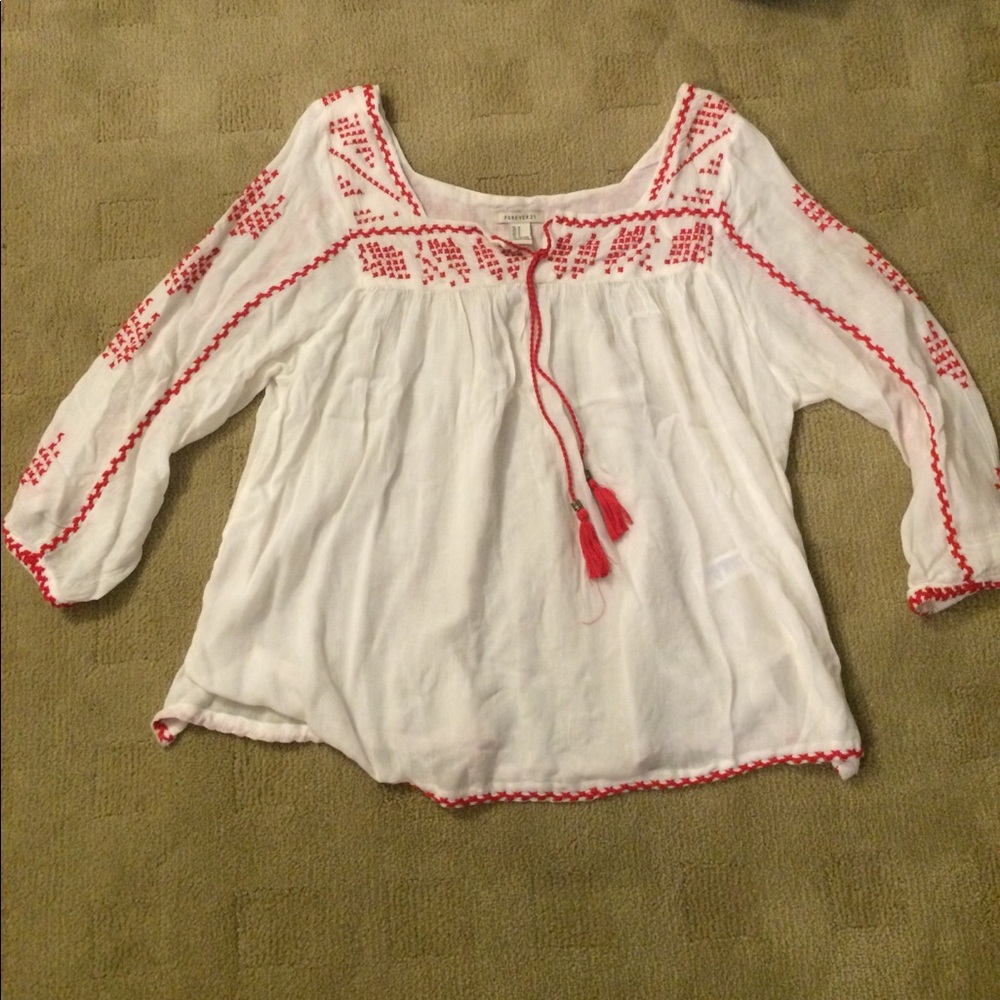 White flowy shirt with red stitching