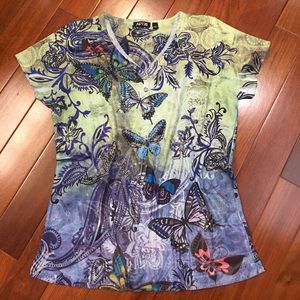 Butterfly top with sparkly embellishments.