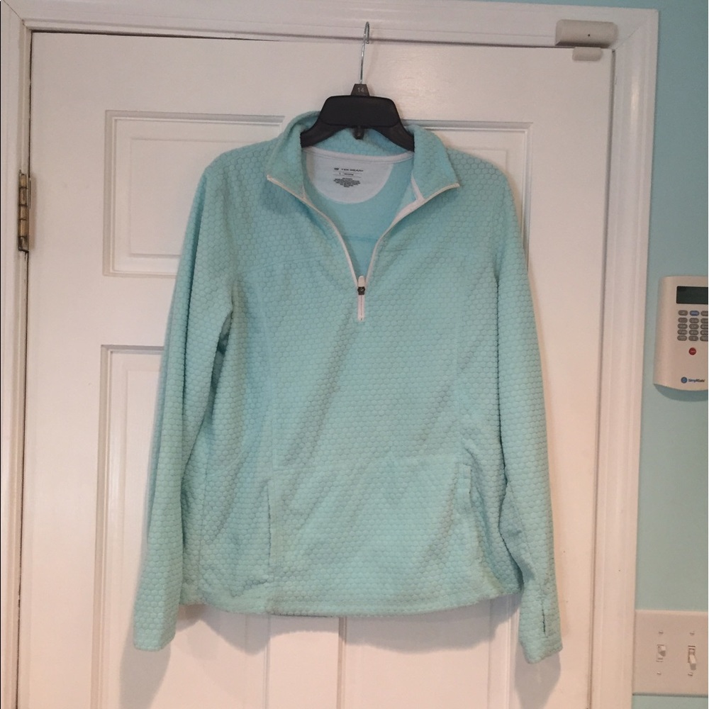 Light blue pullover.
