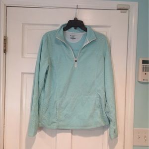 Light blue pullover.