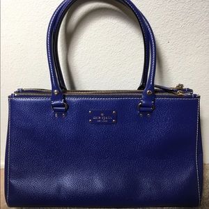 A big blue Kate spade bag