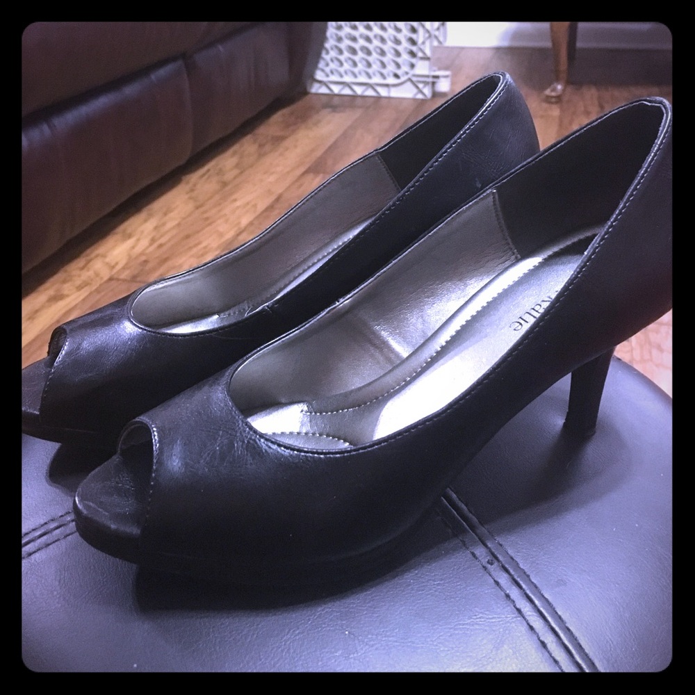 Barely worn peep toe black leather heel
