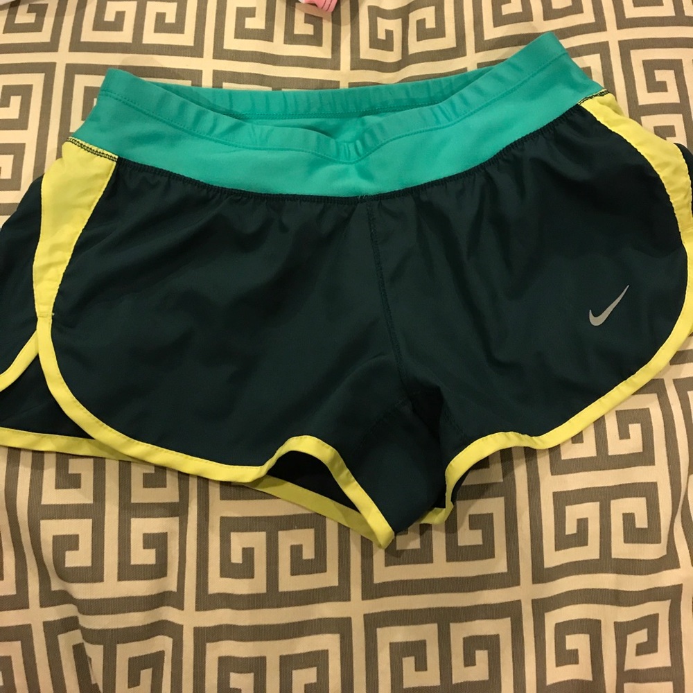 green nike shorts