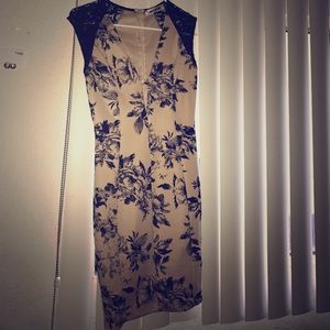 Small beige dress with black flowers