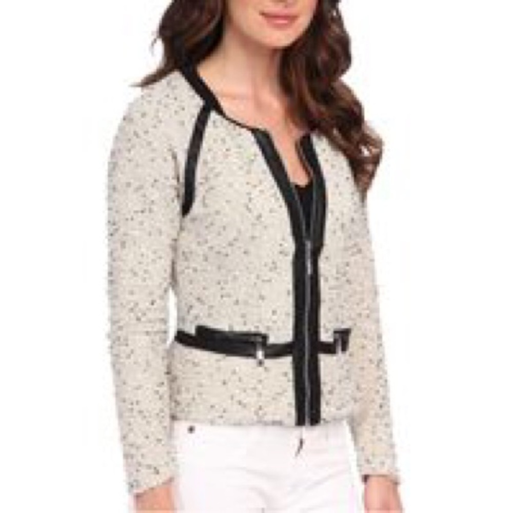 Cream tweed and black leather jacket