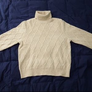 Turtle neck sweater.