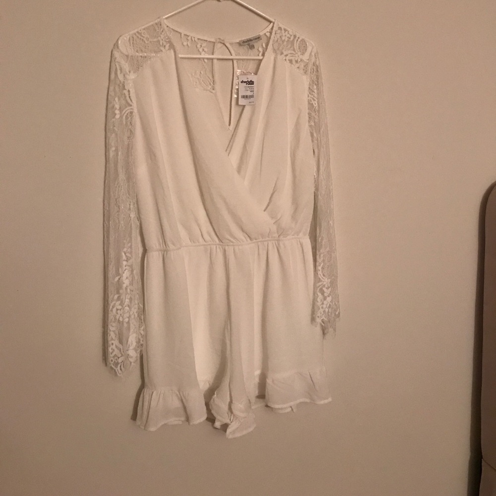 White romper with bell sleeve.