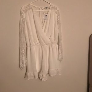 White romper with bell sleeve.