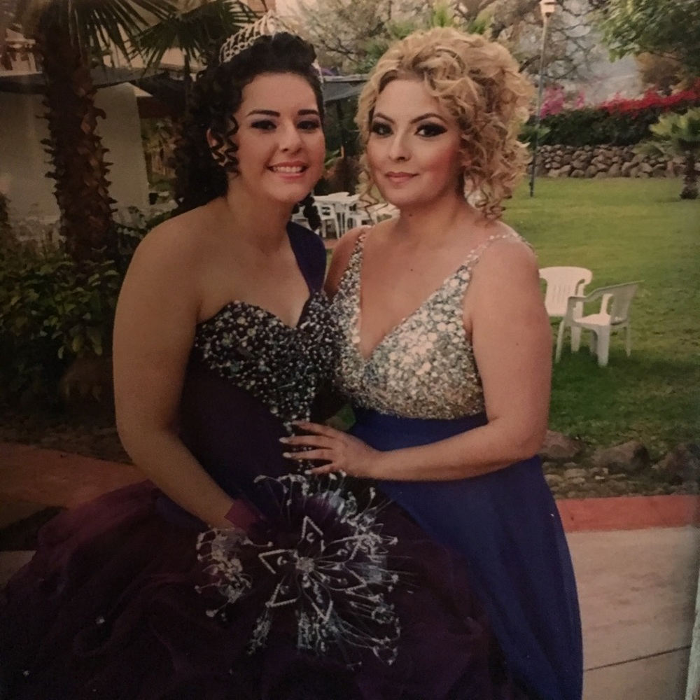 Deep blue gown adorned with brilliant crystals