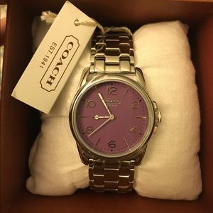 Purple face coach watch