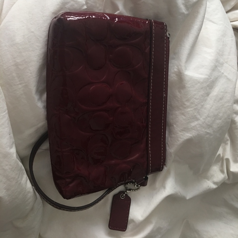 Burgundy red patent leather Coach wristlet