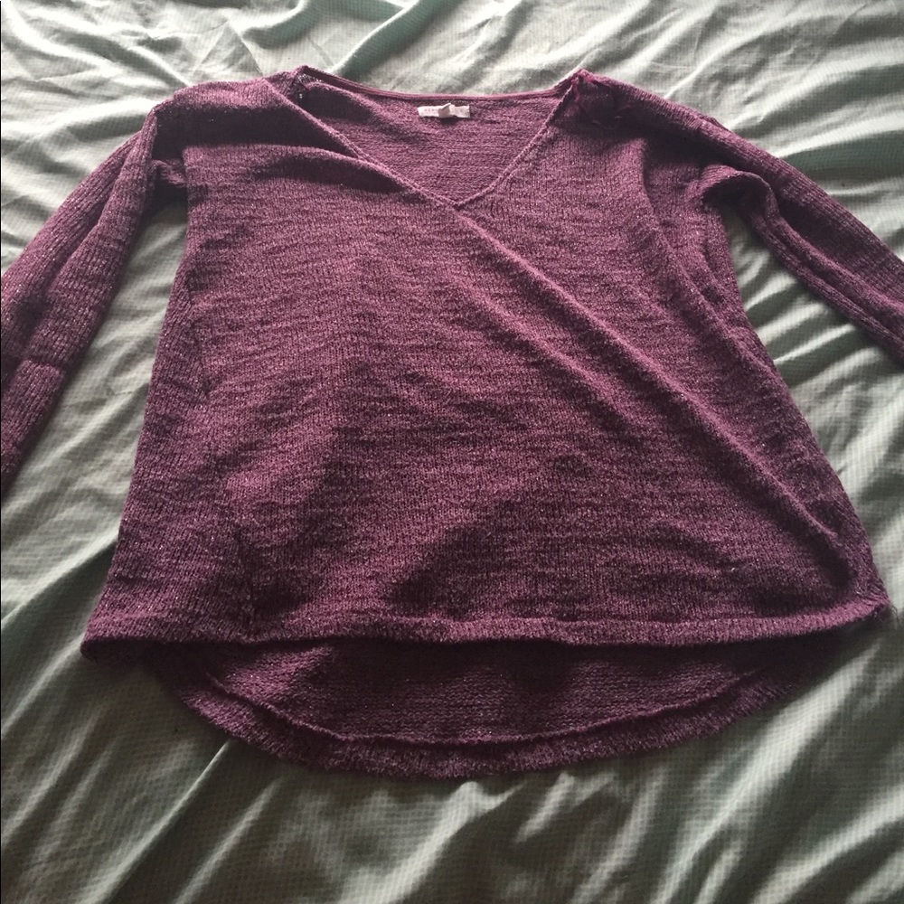 A sparky wine color v neck sweater.