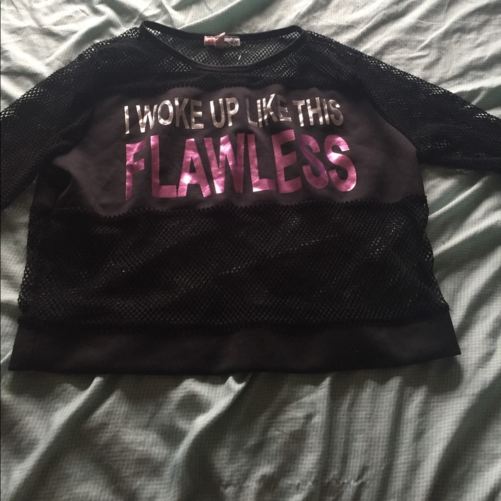 A fishnet shirt with a statement piece.