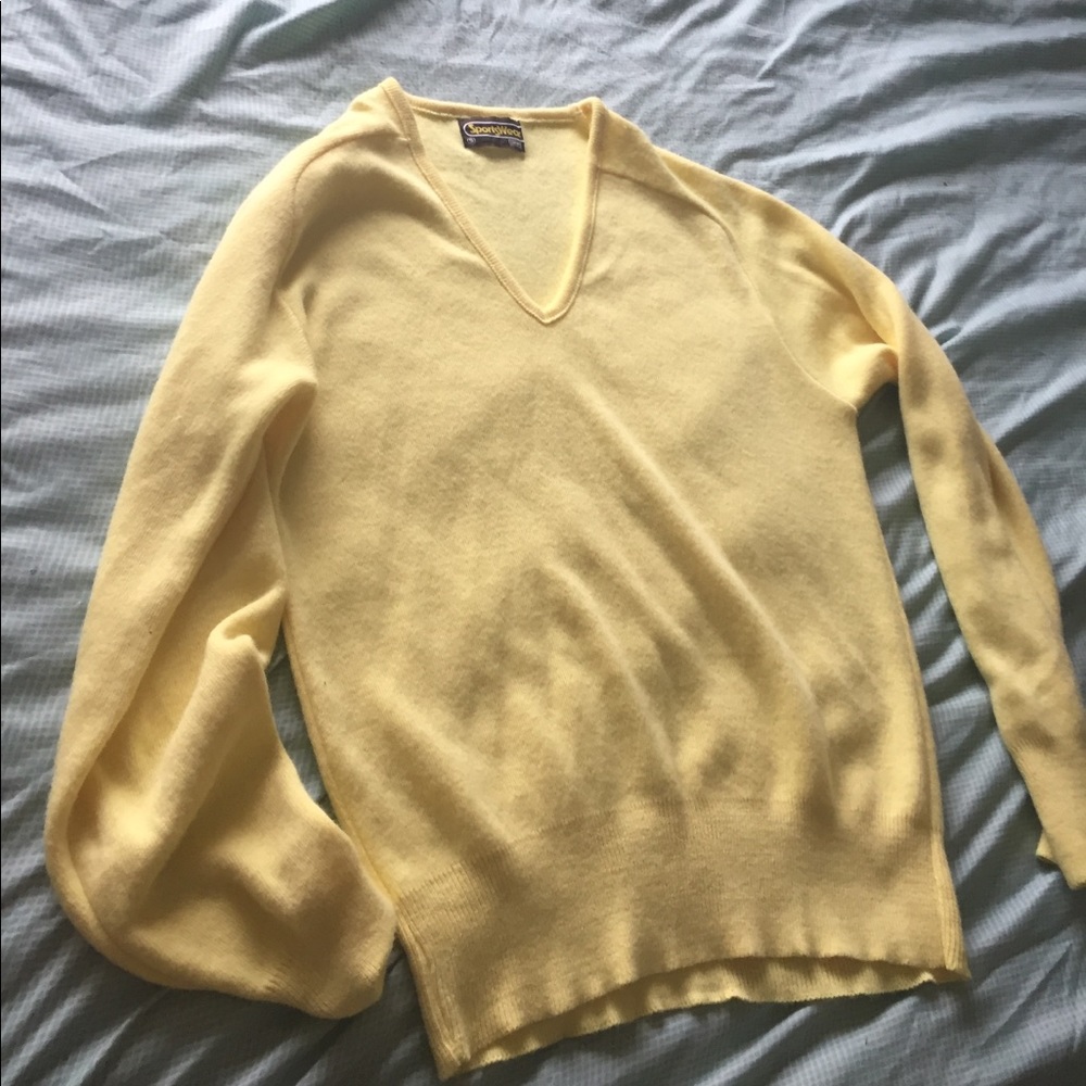 A bright yellow unisex v neck sweater.