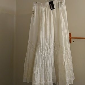 White long skirt with lace trimming.